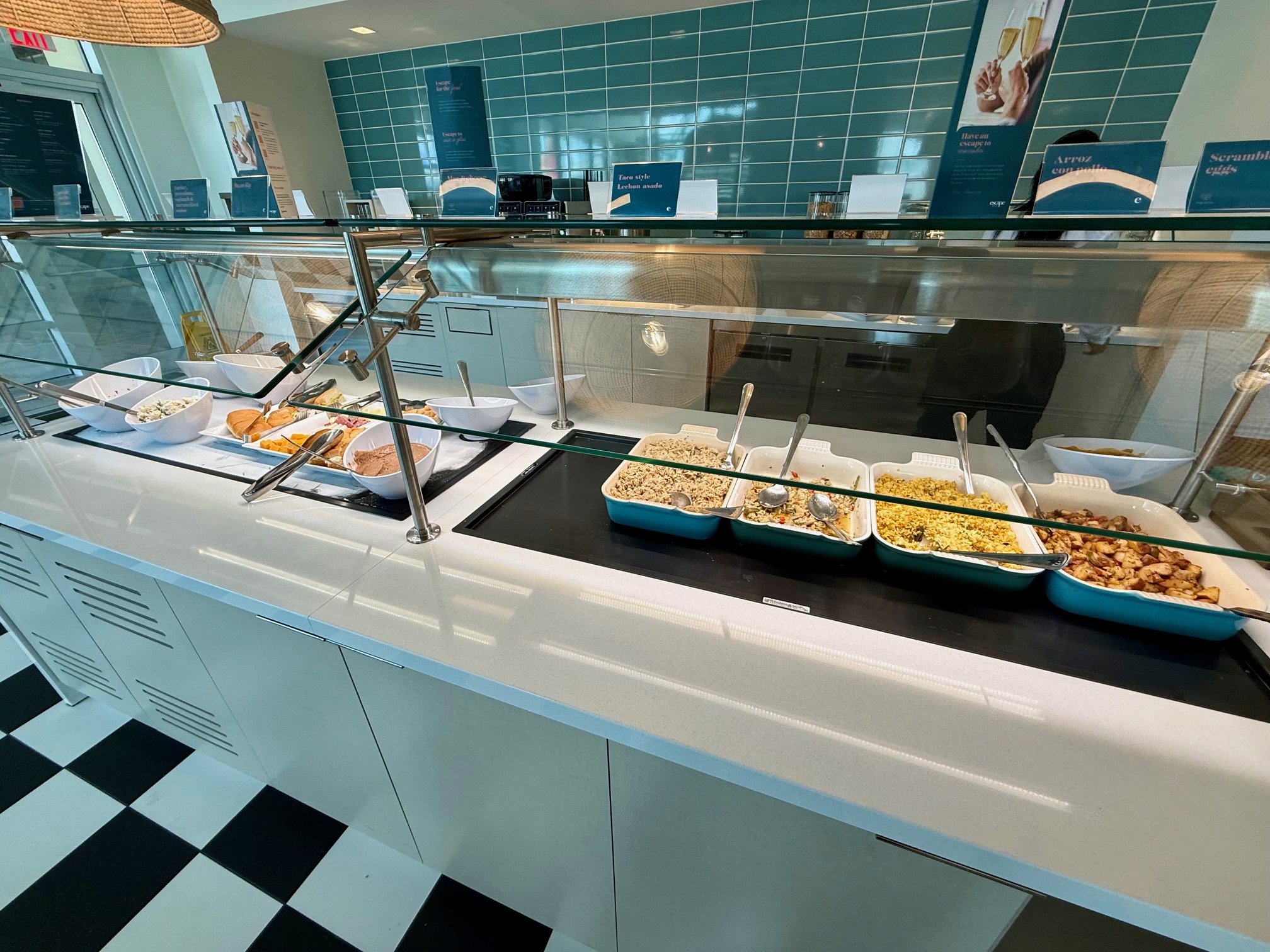 a buffet with food in bowls at the Escape Lounge San Juan