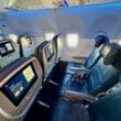 a row of seats in the Delta A321neo Main Cabin