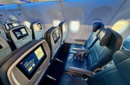 a row of seats in the Delta A321neo Main Cabin