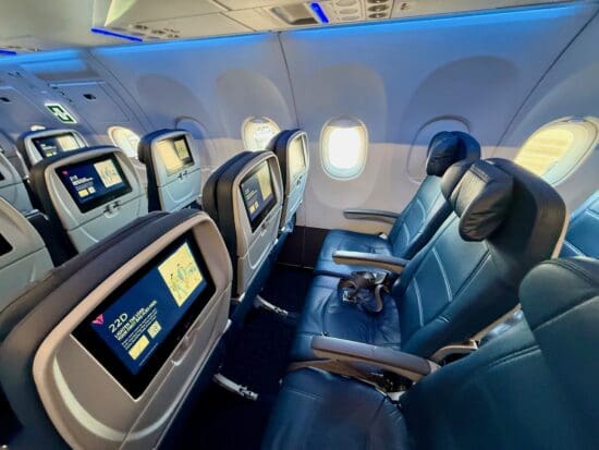 a row of seats in the Delta A321neo Main Cabin