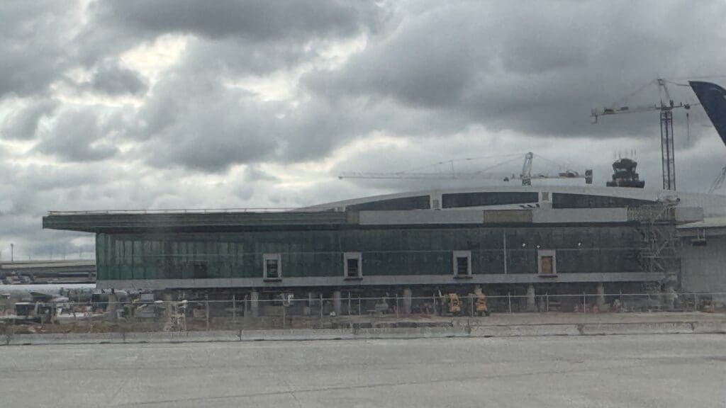 a building under construction with a crane in the background