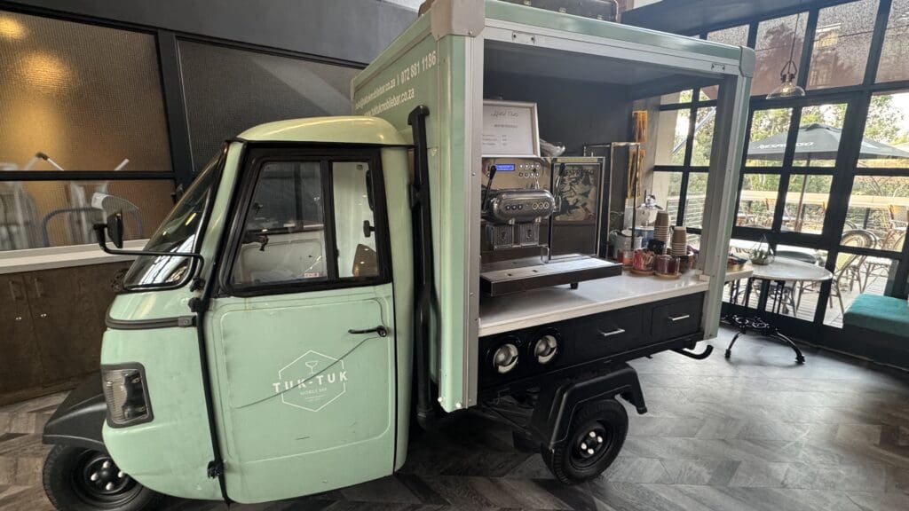 a green truck with a counter and a shelf
