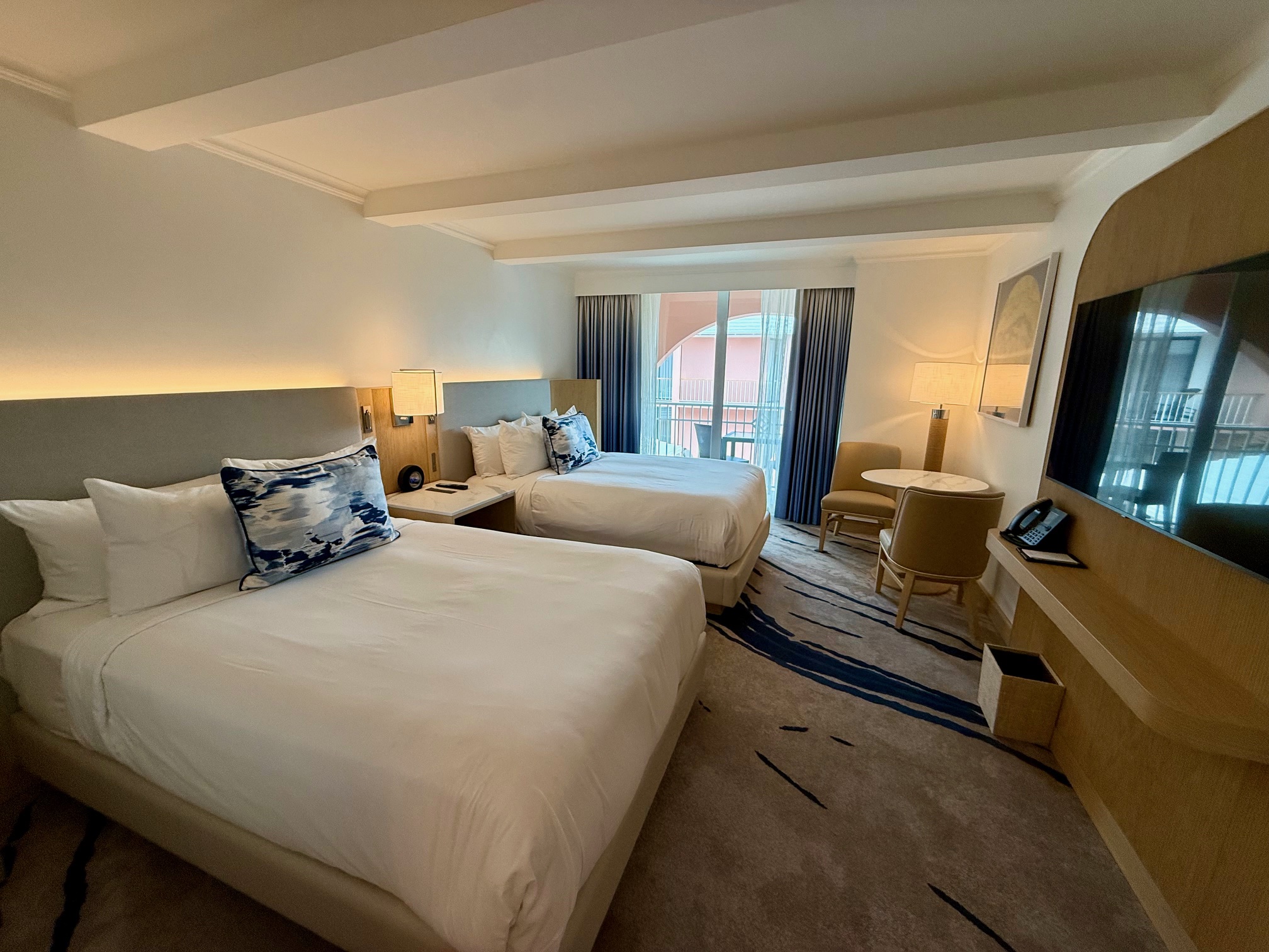 a room with two beds and a television at the Fairmont Hamilton Princess