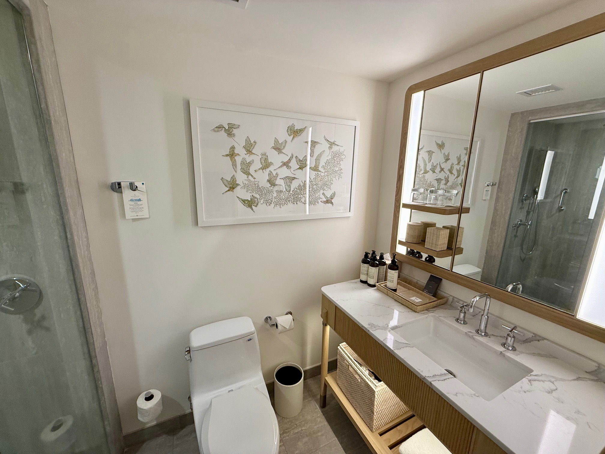 a bathroom with a sink and mirror at the Fairmont Hamilton Princess