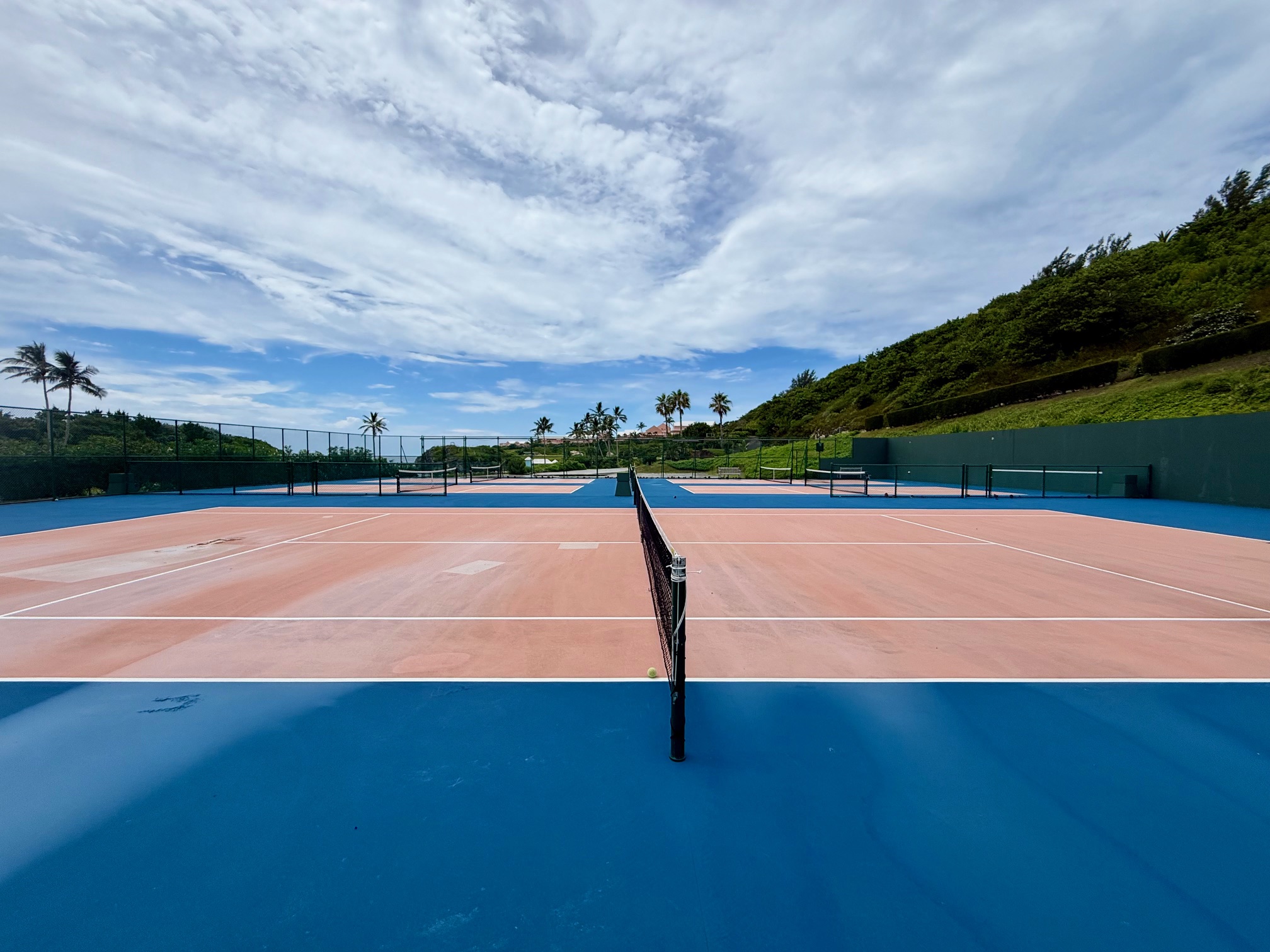 a tennis court with a net at the Fairmont Hamilton Princess