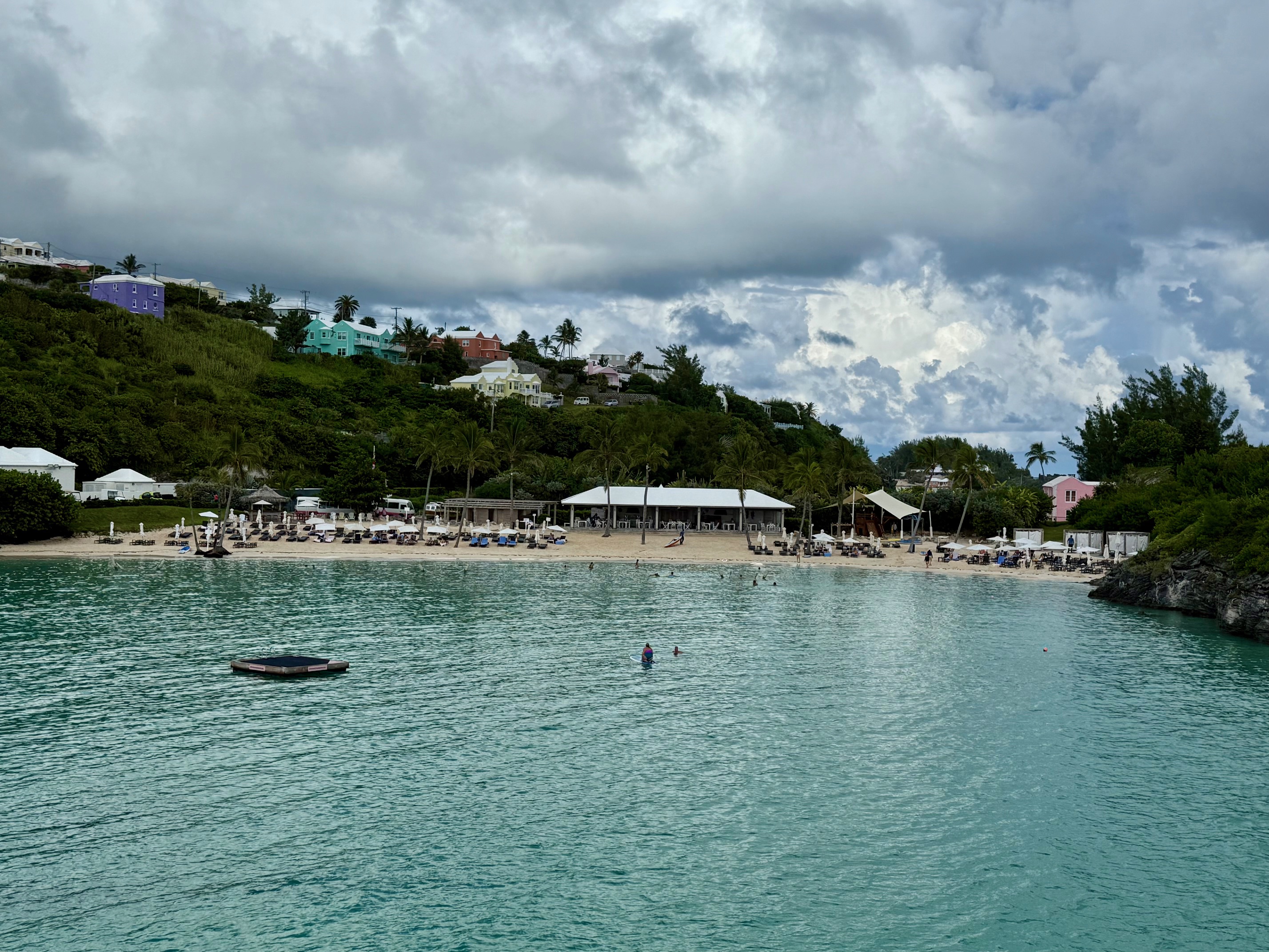 a body of water with people on it at the Fairmont Hamilton Princess Beach Club