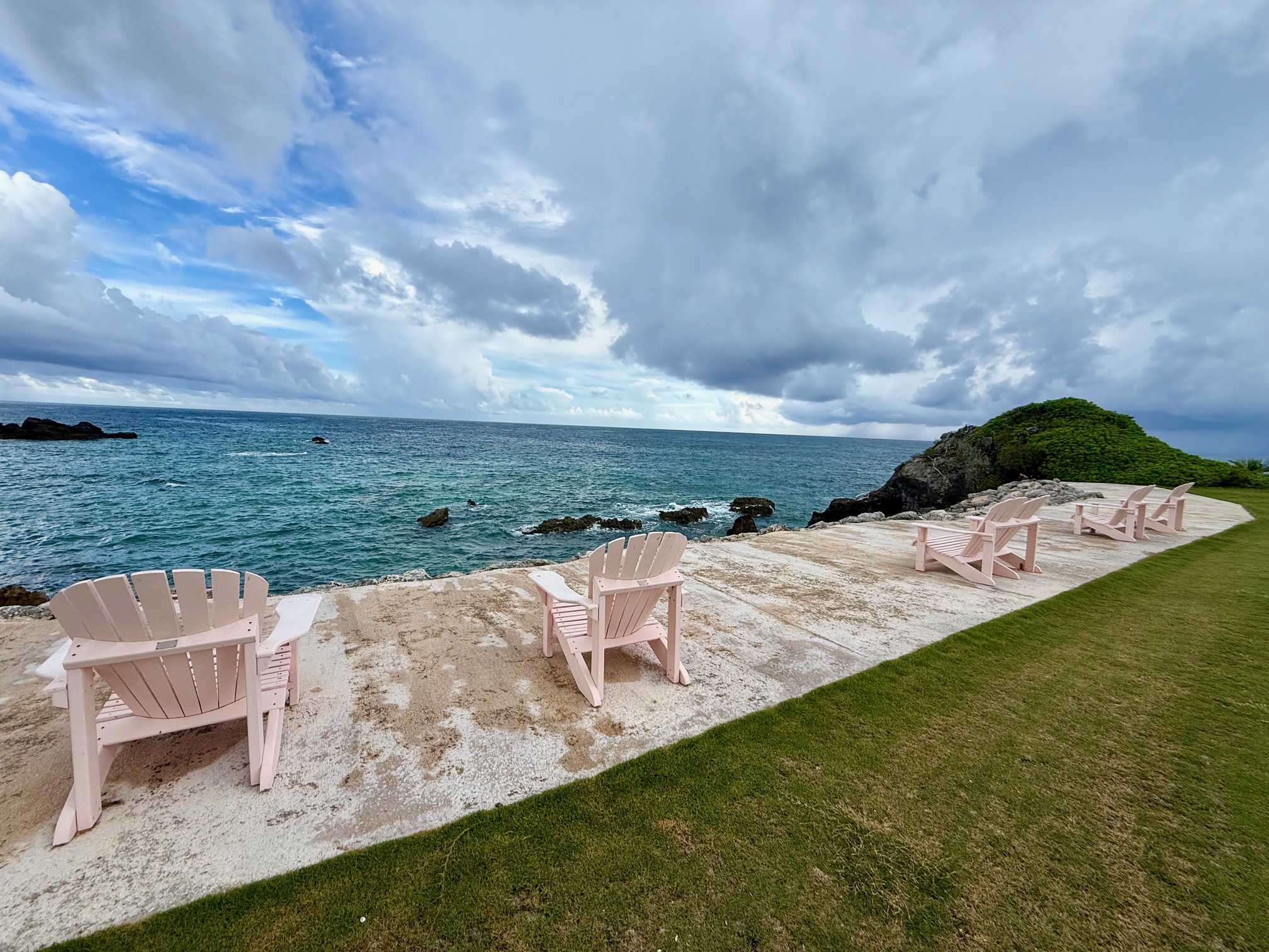 a row of chairs on a beach
