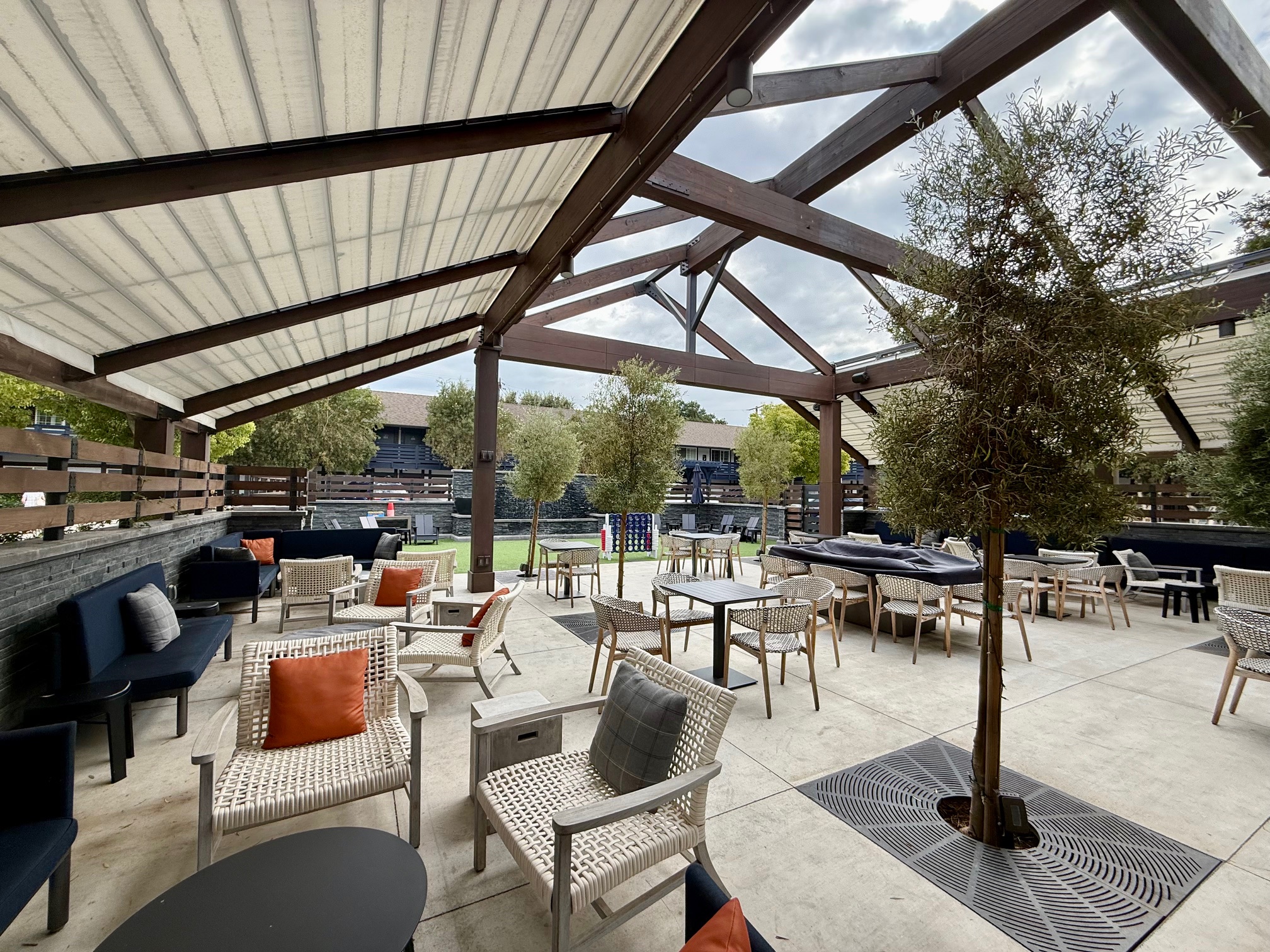 a patio with chairs and tables
