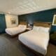 two beds in a room at the Hadsten Solvang