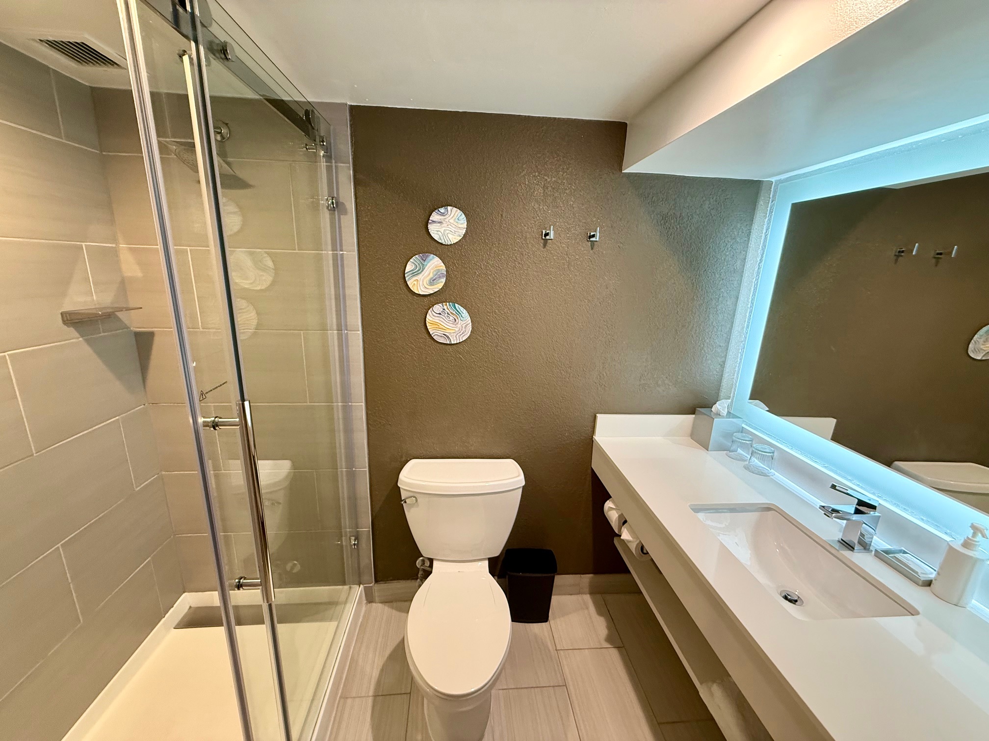 a bathroom with a shower and toilet at the Melville Marriott Long Island