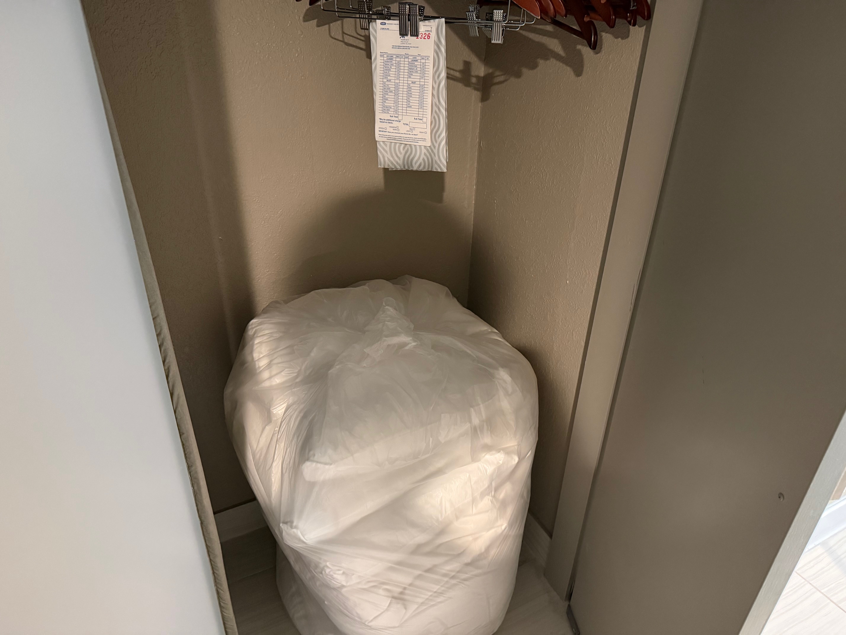 a white bag in a closet