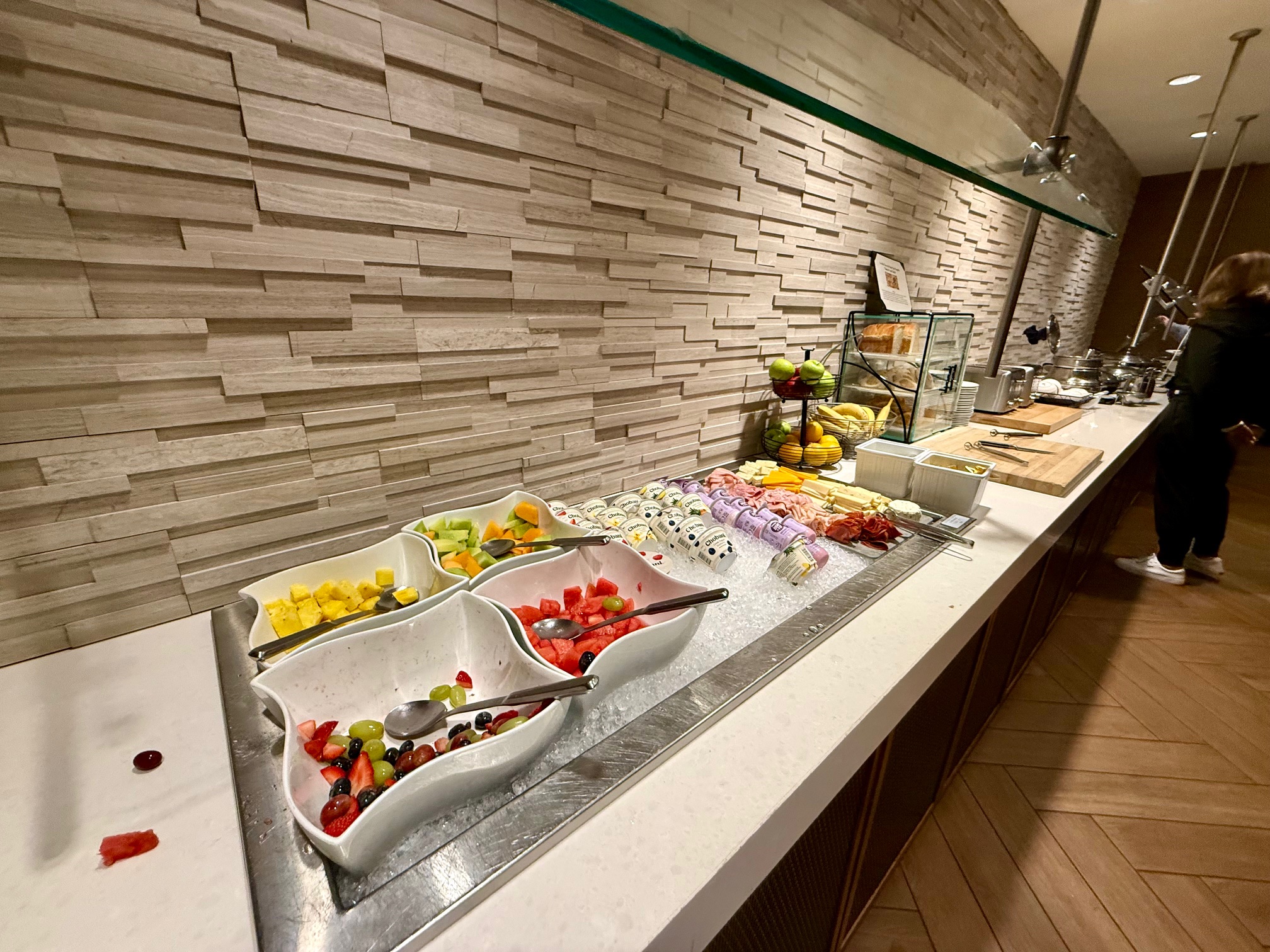 a buffet with fruit and desserts