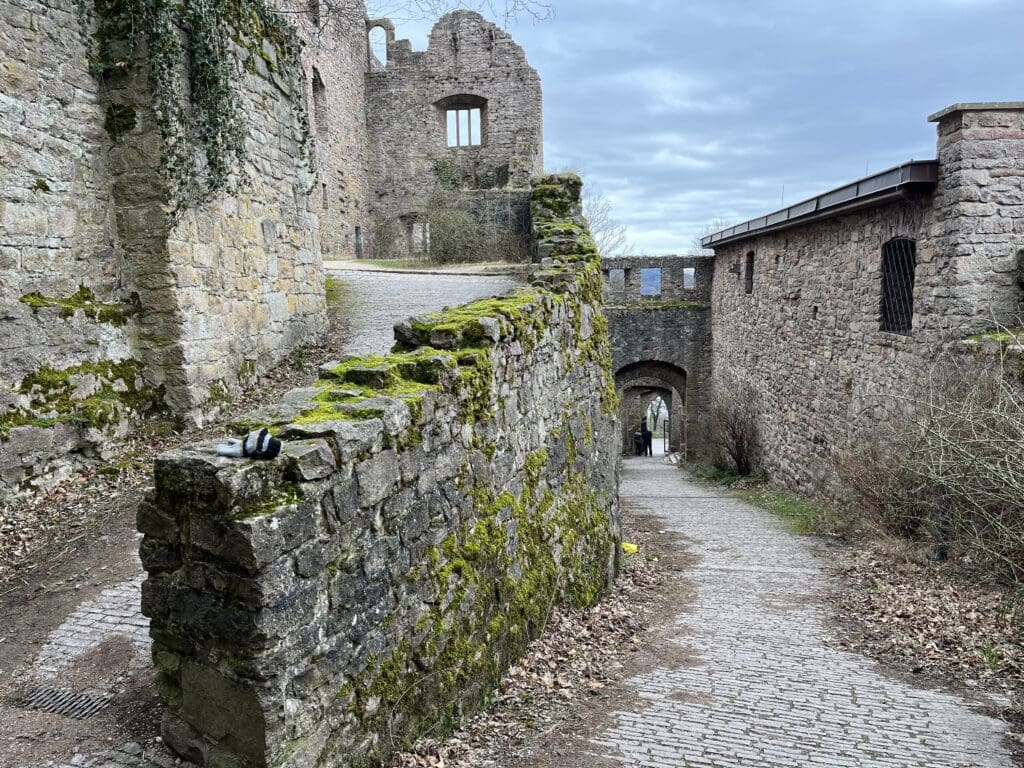 a stone wall with moss growing on it