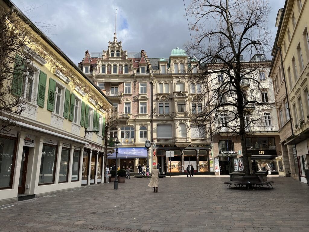 a group of buildings with a tree in the middle