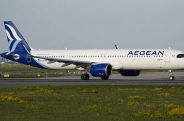 a white airplane on a runway