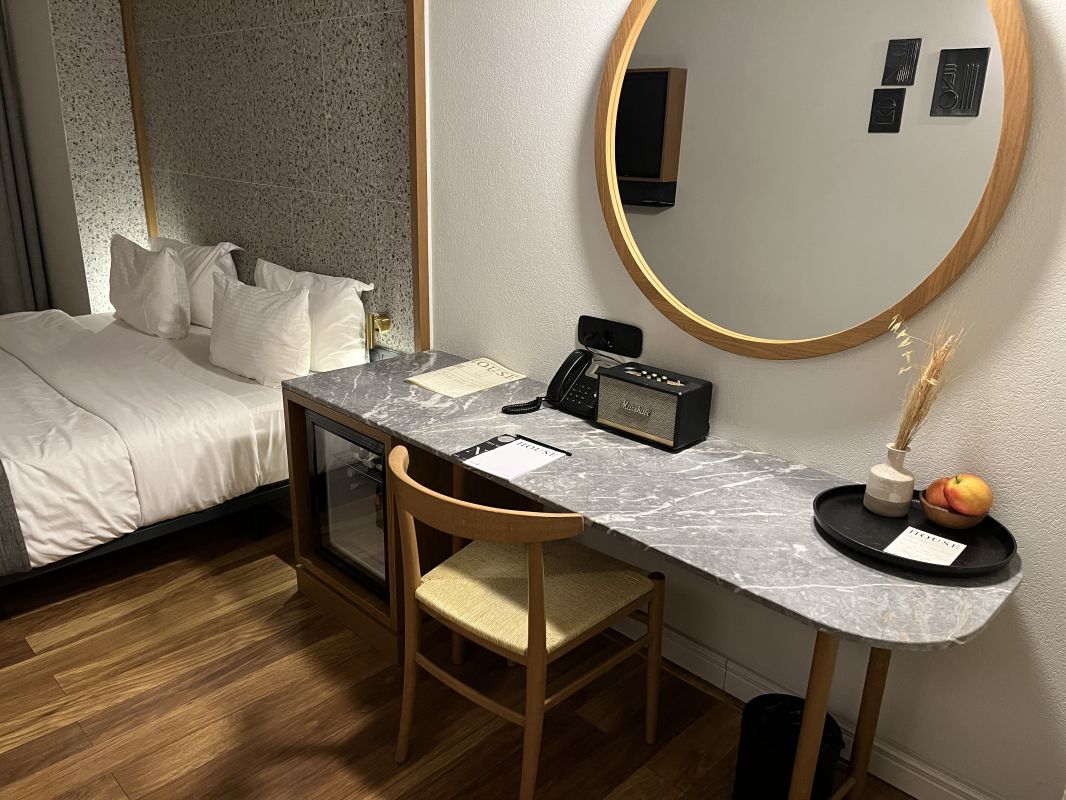 a room with a bed and a mirror