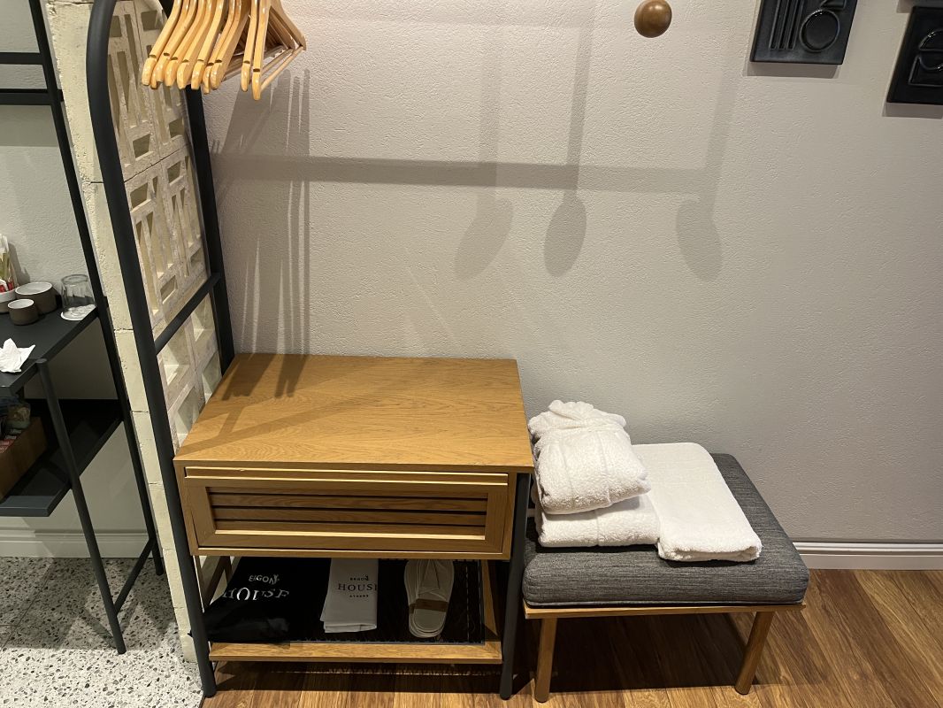a clothes rack with a shelf and a shoe rack