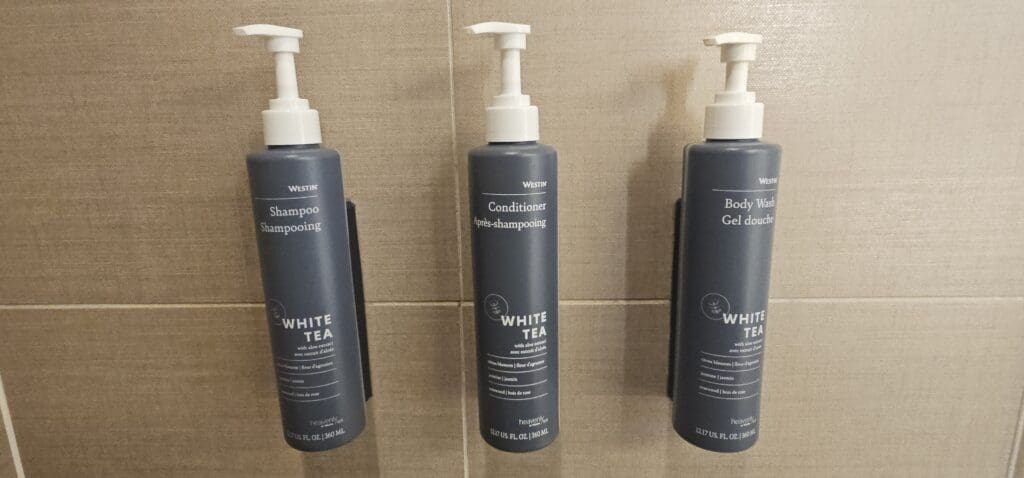 a group of shampoo bottles on a wall