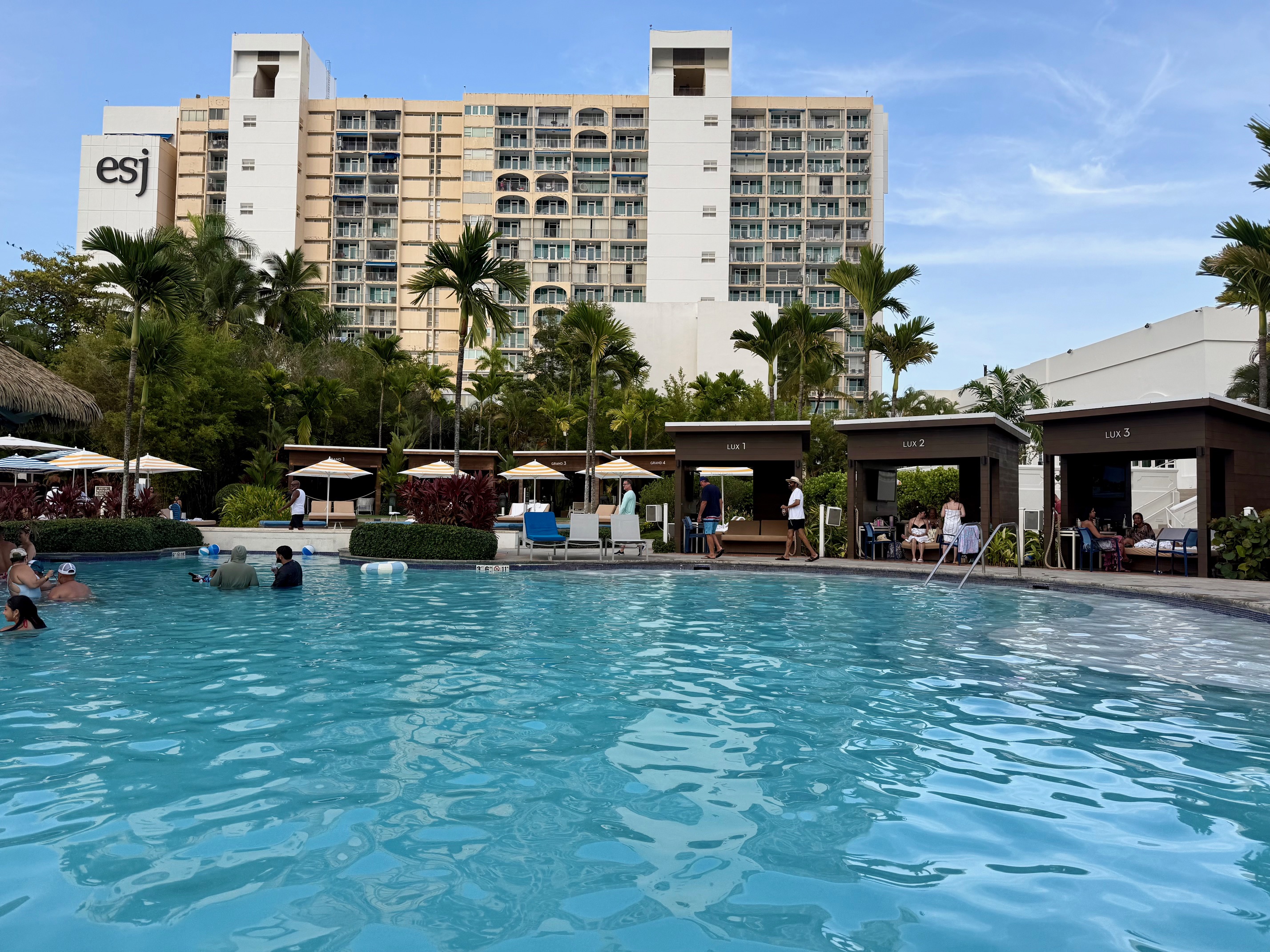 a pool with people standing around it
