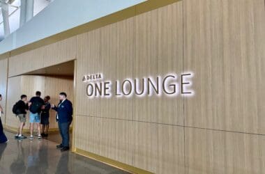 a group of people standing in front of Delta One Lounge New York