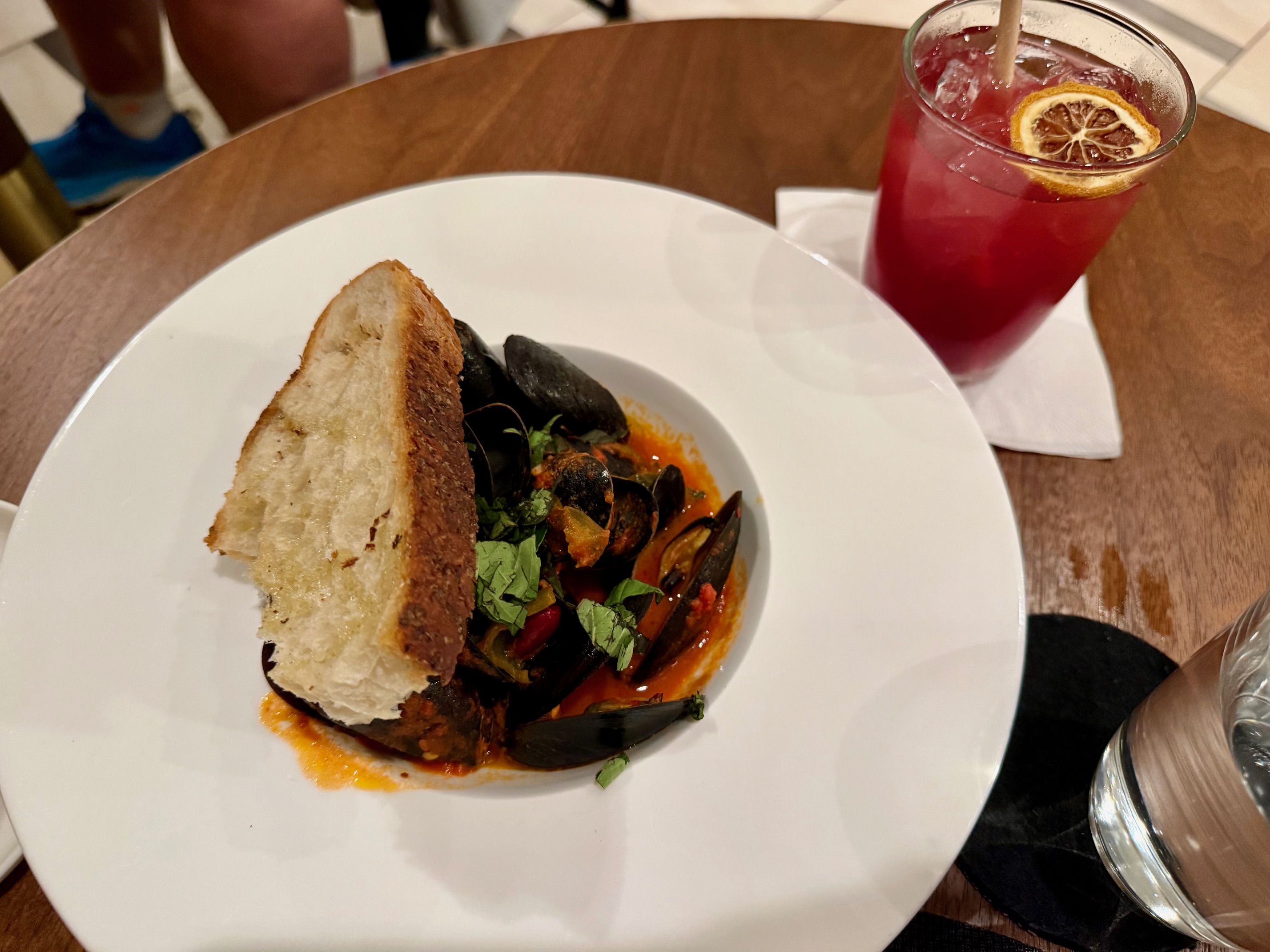 a plate of food and a drink on a table