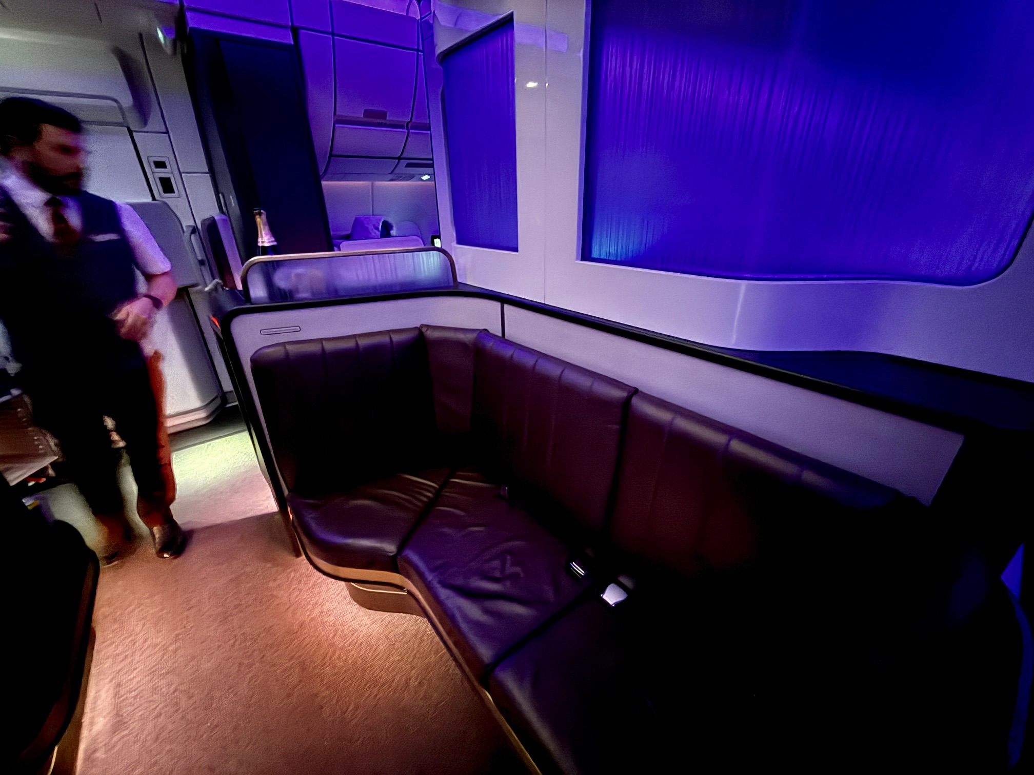 a man standing in a room with a couch