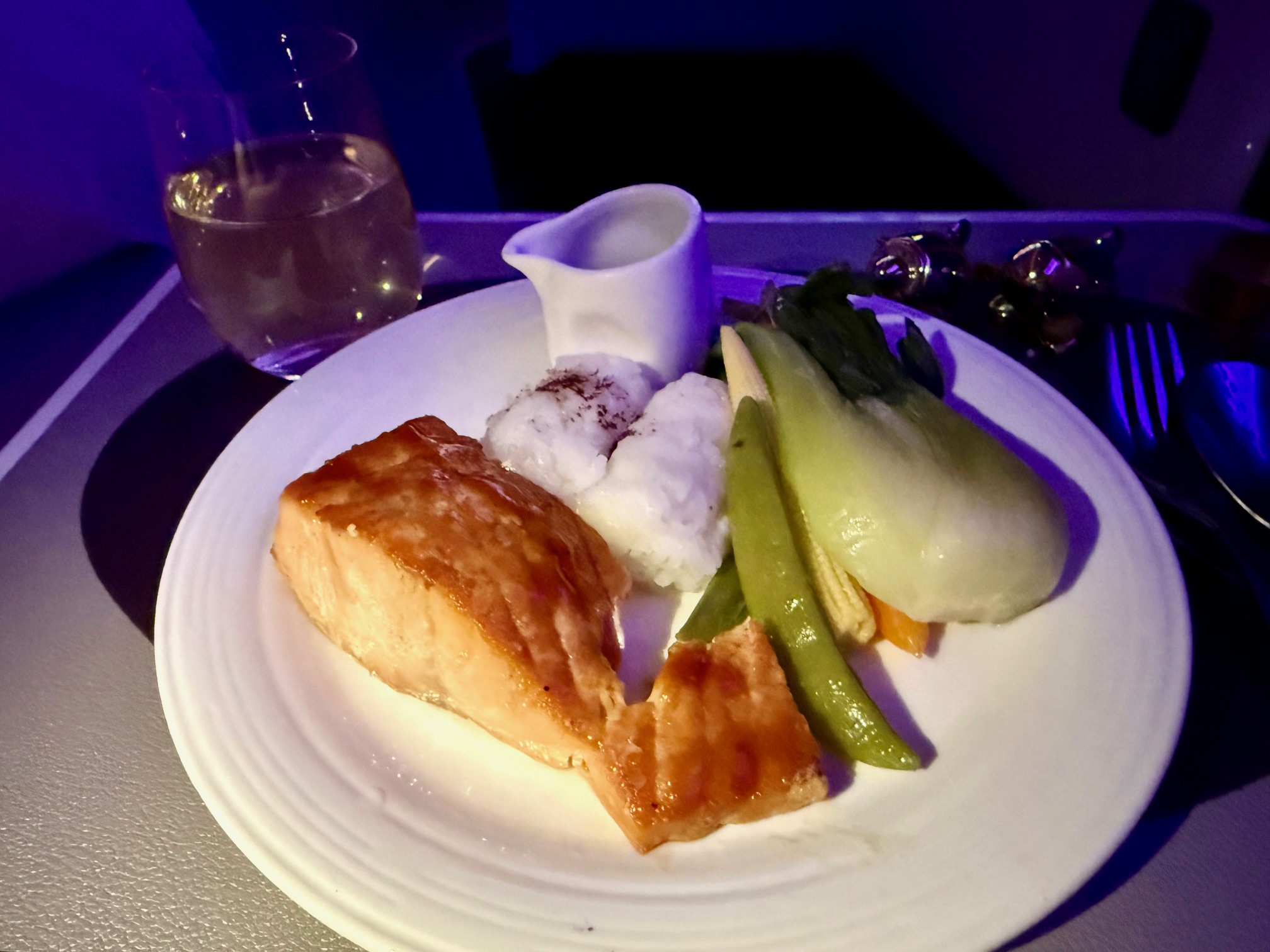 a plate of food on a table in Virgin Atlantic A350 Upper Class 