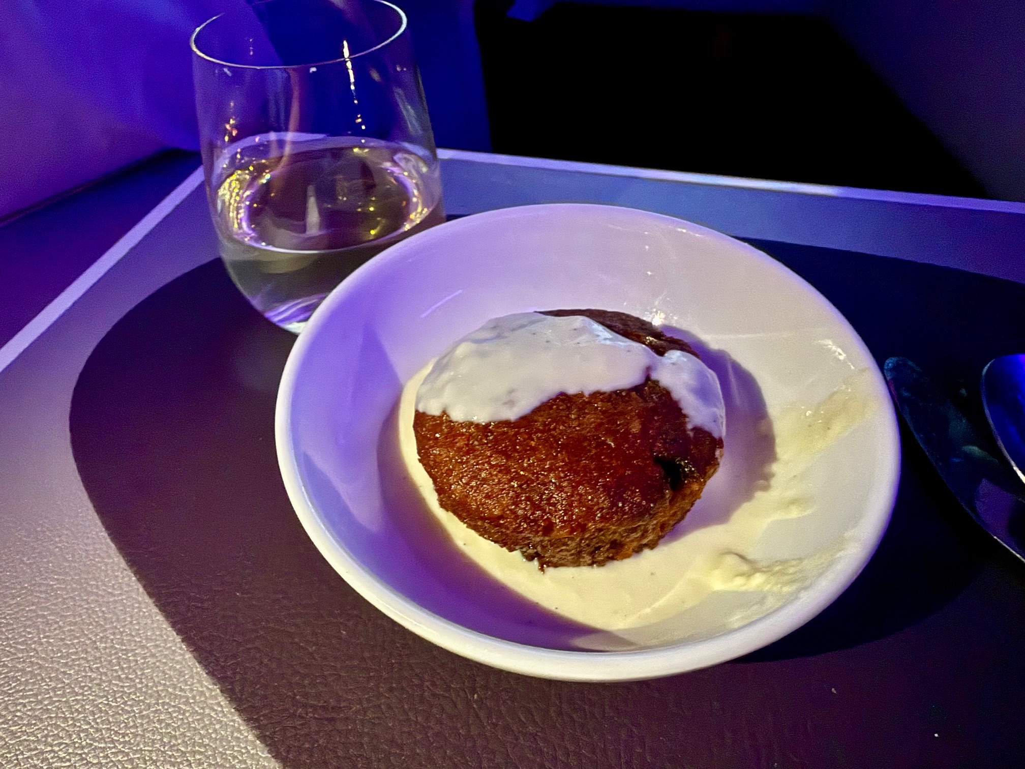 a plate of food and a glass of water