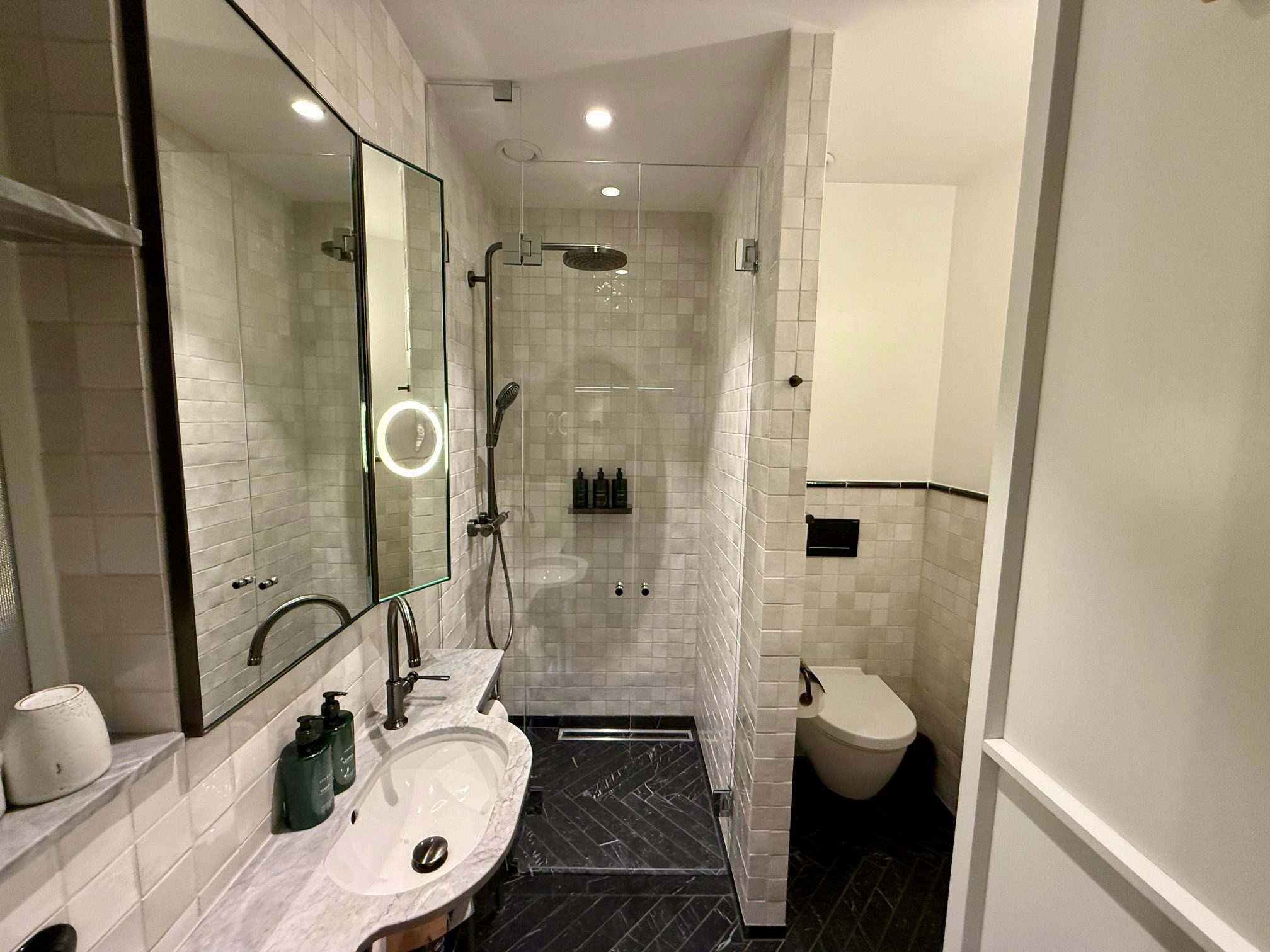a bathroom with a mirror and sink at Villa Copenhagen