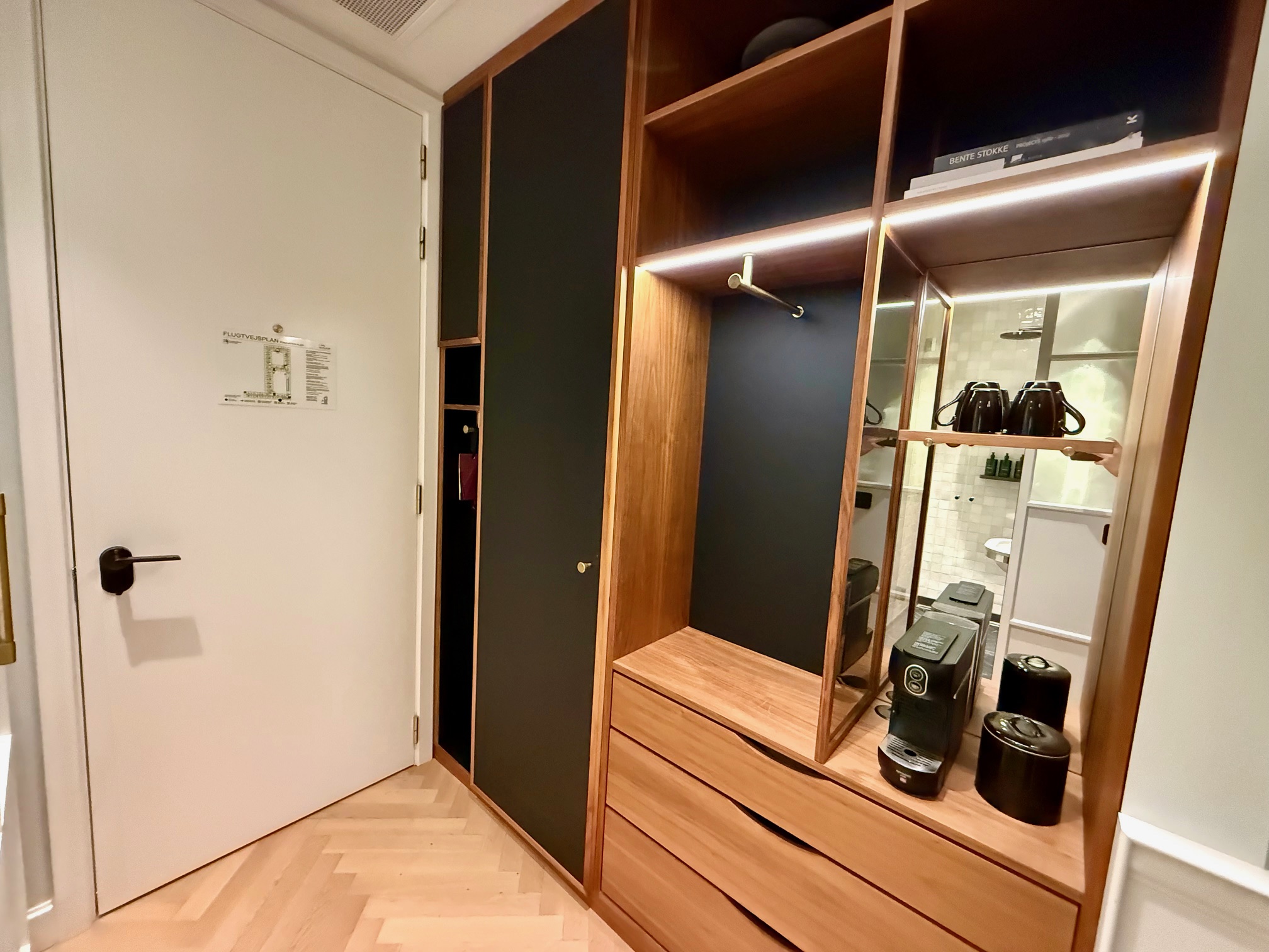 a room with a closet and a mirror