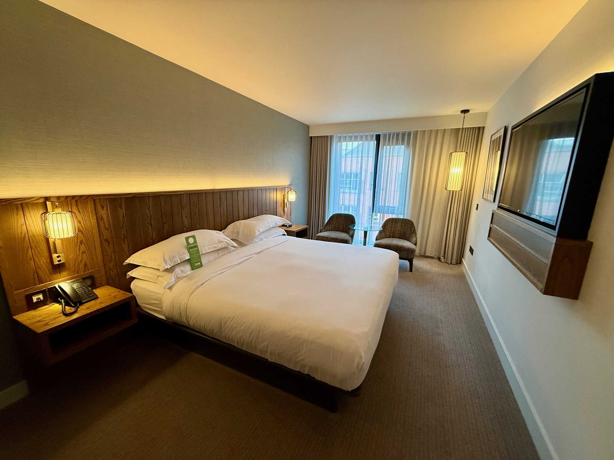 a room with a bed and a television