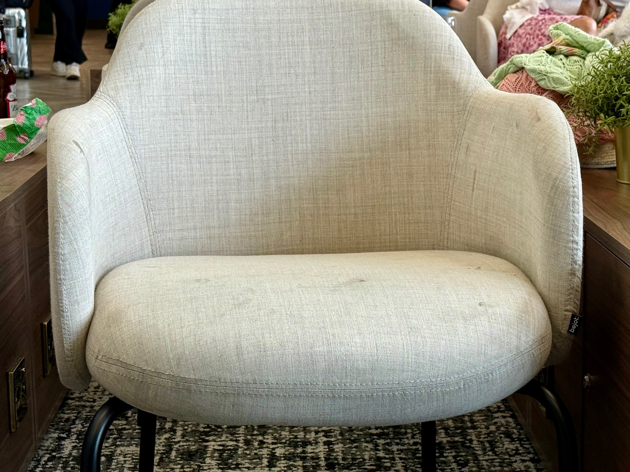 a white chair with black legs