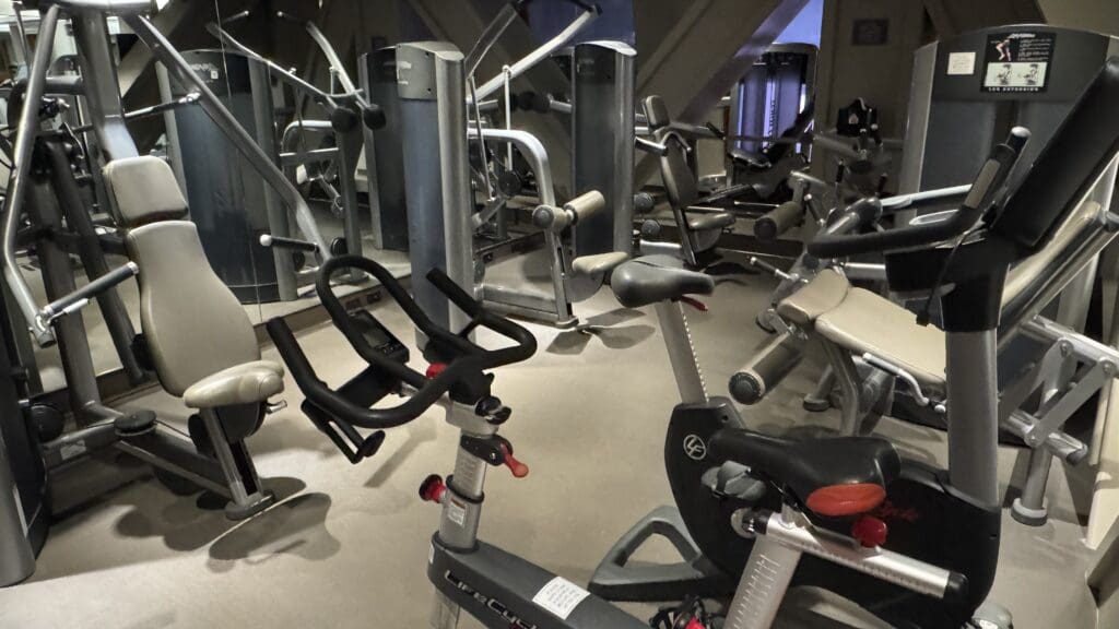 a group of exercise bikes in a gym