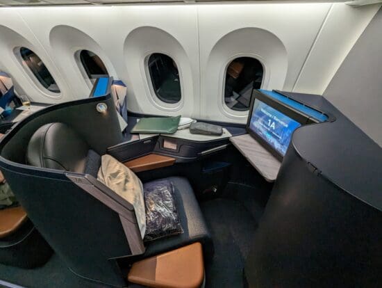 a computer on a chair in a plane