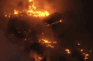 a house on fire at night