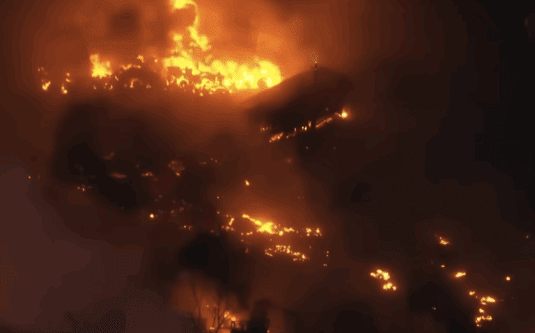 a house on fire at night