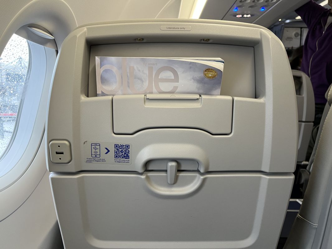 a seat with a magazine in it