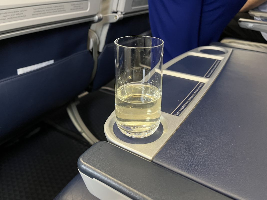 a glass of liquid on a tray