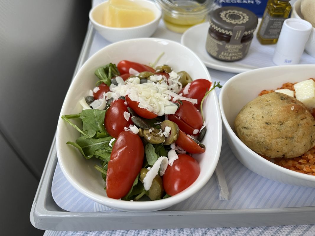 a bowl of salad on a tray