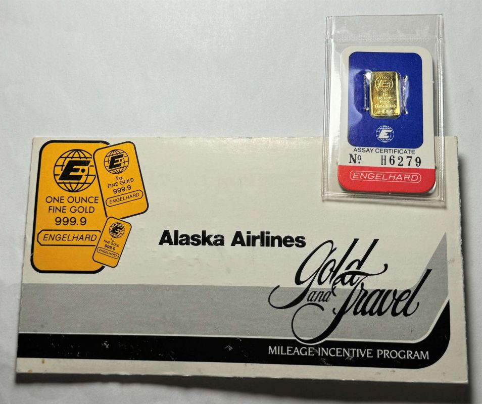 a package with a gold bar and a blue and red label