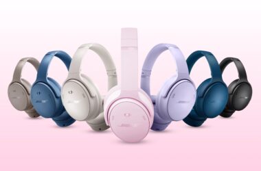 7 sets of Bose QuietComfort headphones in various colors on a pink and white background