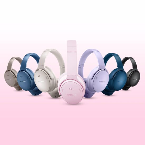 7 sets of Bose QuietComfort headphones in various colors on a pink and white background