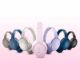 7 sets of Bose QuietComfort headphones in various colors on a pink and white background