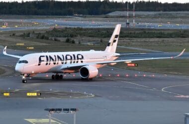 a white airplane on a runway