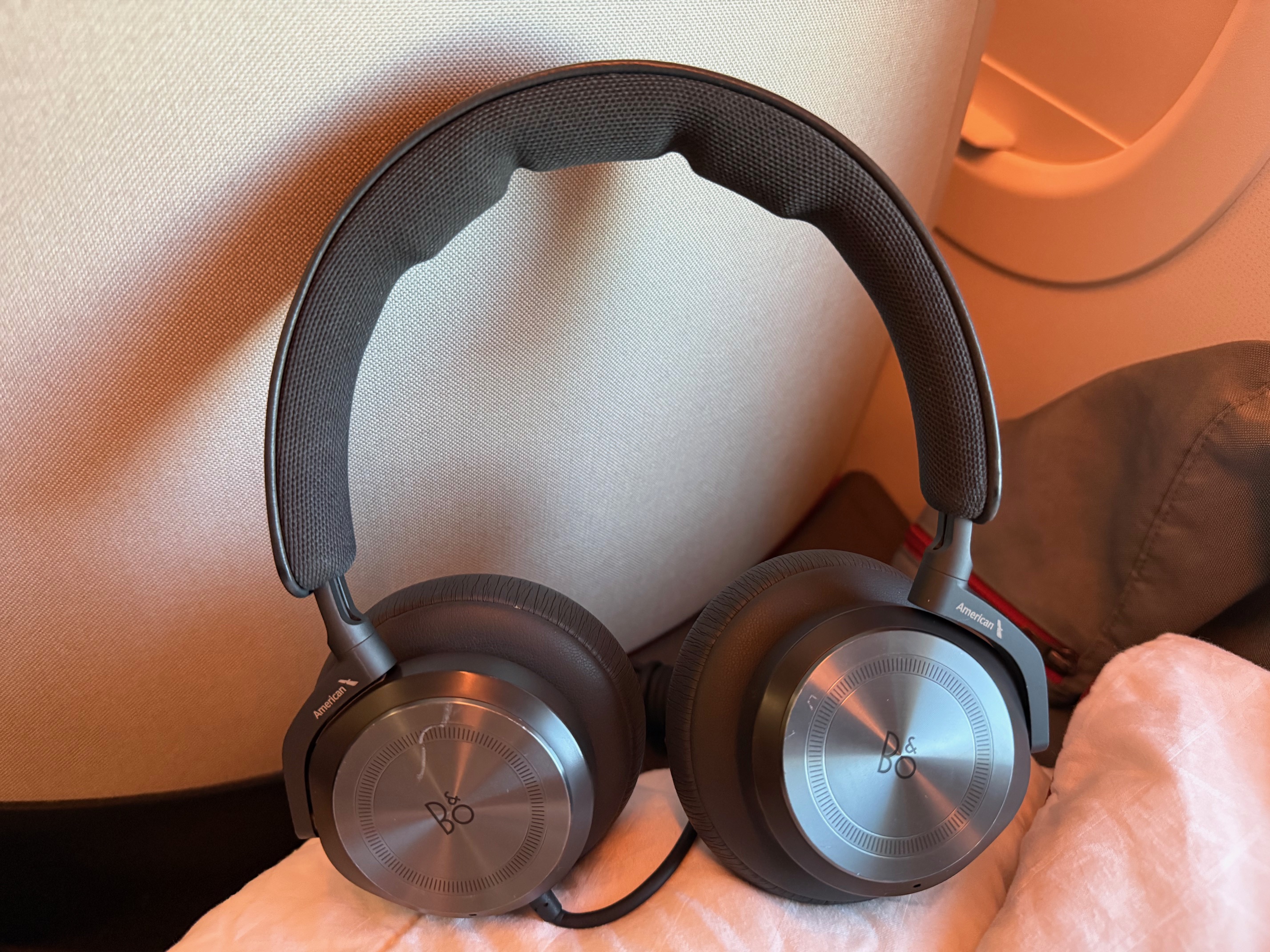 a pair of headphones on a bed