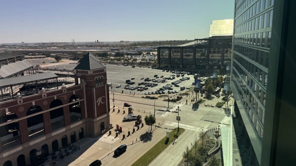 a parking lot with cars and buildings