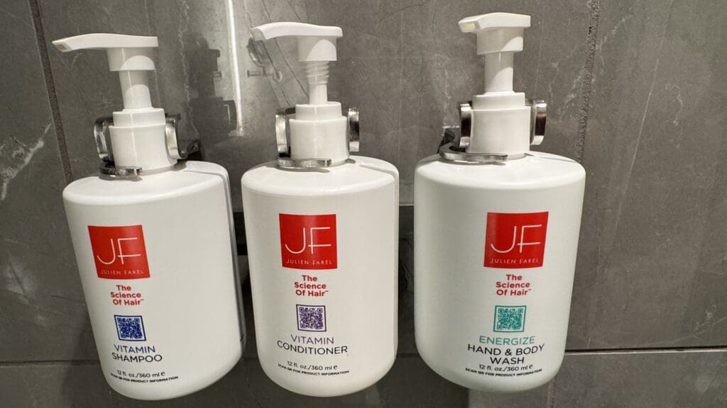 a group of white containers with red and white labels