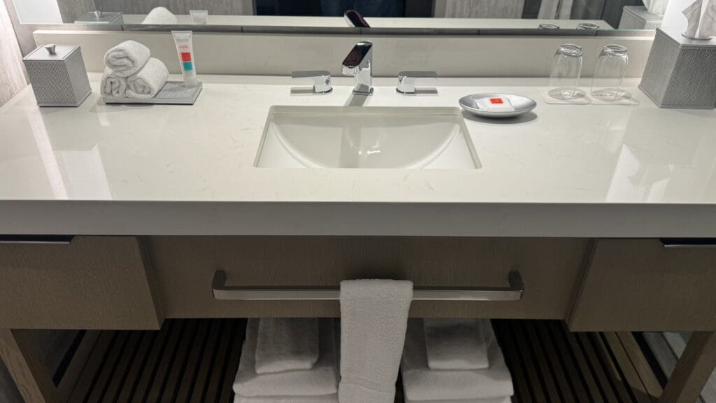 a bathroom sink with a towel on the counter