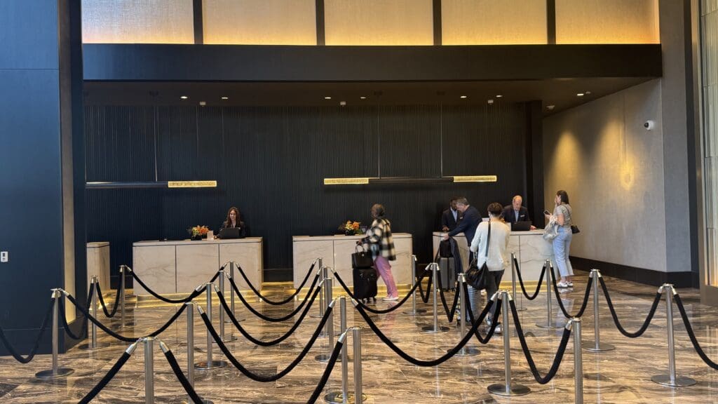 people standing in front of a hotel reception