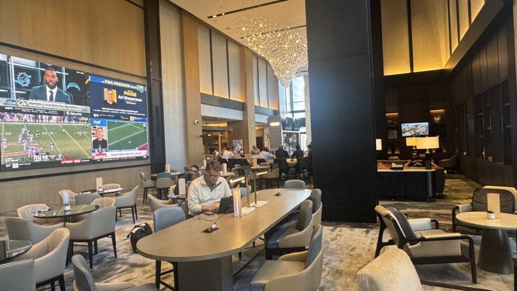 a man sitting at a table in a hotel